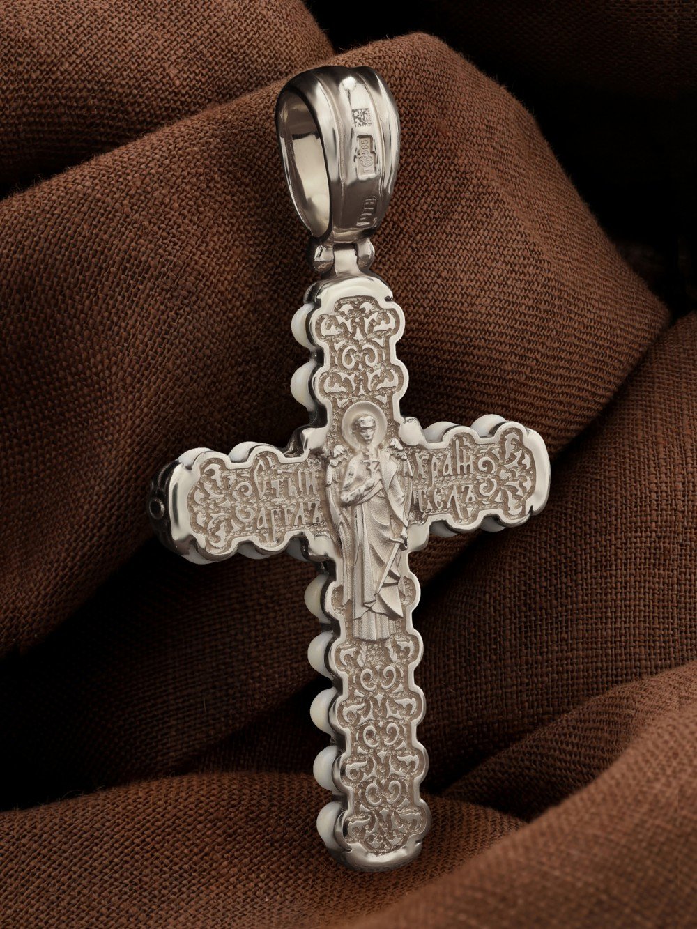 Крест из белого золота c кахолонгом